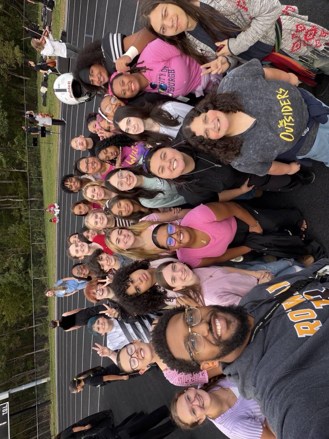 Choir outdoors at sunset